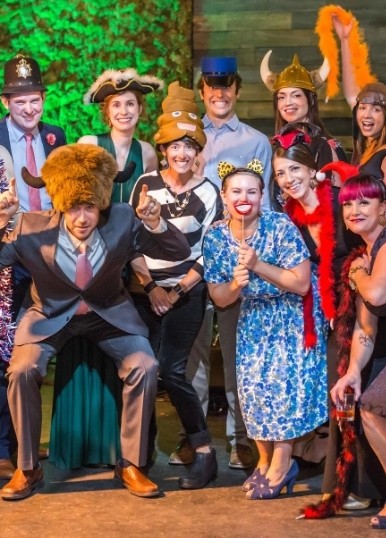 Guests in costume props at the photo booth