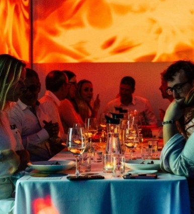 Dinner table washed in orange light